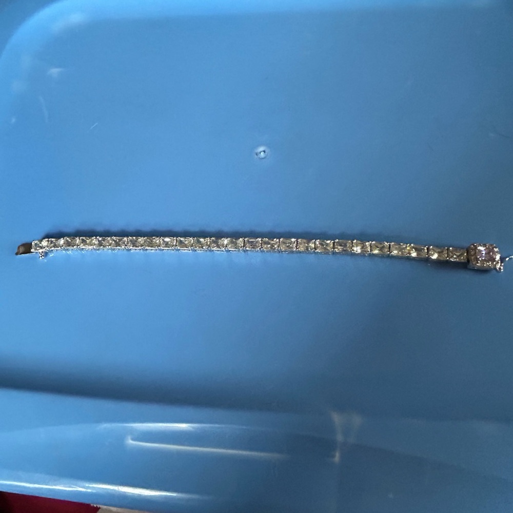 Beautiful sterling silver bracelet with purple stone and clear stones.8.5 inches